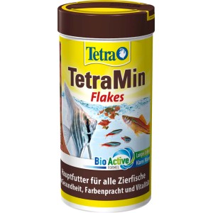 Tetra Min Flakes 250ml: Flockenfutter für Zierfische im gelben Behälter mit Fischen.