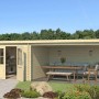 Lasita Gartenhaus St Louis, 681x292 cm, unbehandelt. Holzhaus mit überdachtem Anbau und Doppeltür.