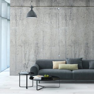 PROFHOME Fototapete in Betonoptik Grau/Grün hinter Sofa und Tisch.