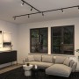Schwarzes Paulmann URail LED-Schienensystem mit Salt Spots im modernen Wohnzimmer. Mattes Design für gerichtetes Akzentlicht.