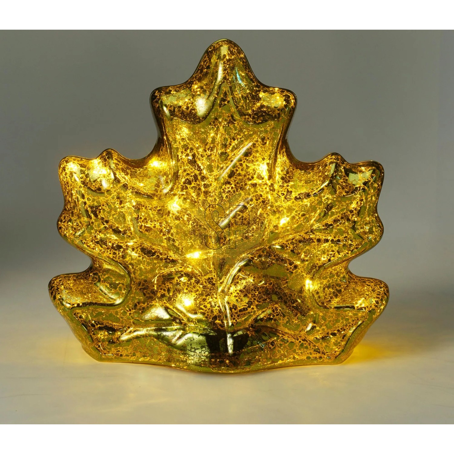Goldenes Glasblatt mit leuchtenden LEDs, Ahornblatt-Design. Dekorative Glaslampe.
