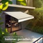 Beige Tectake Gelenkarmmarkise Ornella über Terrasse, schützt vor Sonne. Wasserabweisend, UV-beständig, mit Handkurbel.