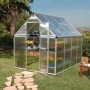 CANOPIA Gewächshaus Silber 4,6 m² mit geöffneter Tür und Pflanzen auf Regalen im Garten.