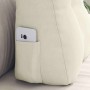 Cremefarbenes Samt-Rückenkissen mit Seitentasche und Smartphone. Ergonomisches Kissen für Rückenstütze und Komfort.