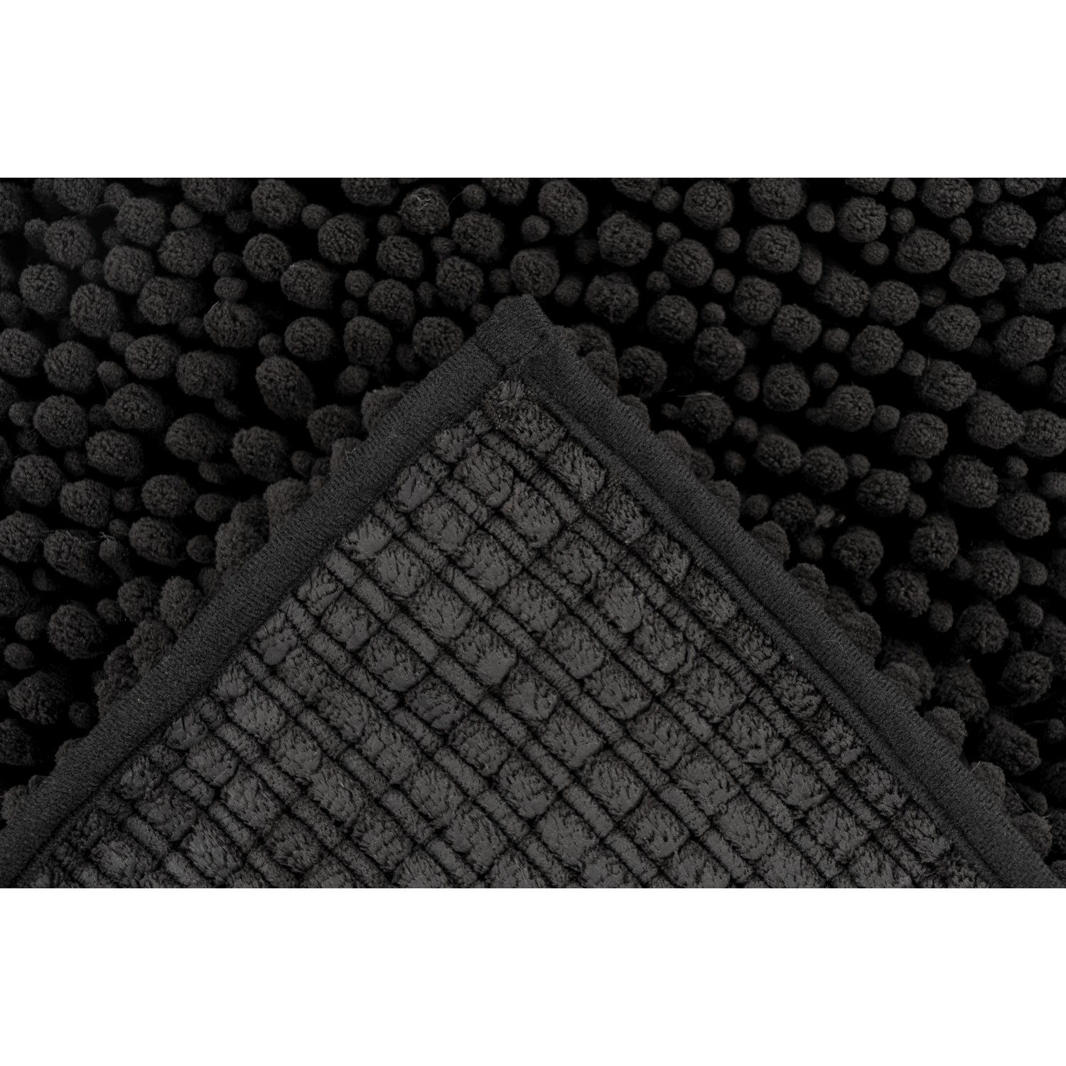Schwarzer Lalee Badteppich Fluffy (40x60 cm) mit Noppenstruktur und rutschfester Rückseite.