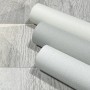 Marburg Vliestapete GZSZ Textiloptik Uni Beige, Rollen auf Holzhintergrund.