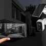 Technaxx Outdoor-Kamera TX-244 Solar mit Solarpanel und Smartphone-Ansicht eines Hauses.