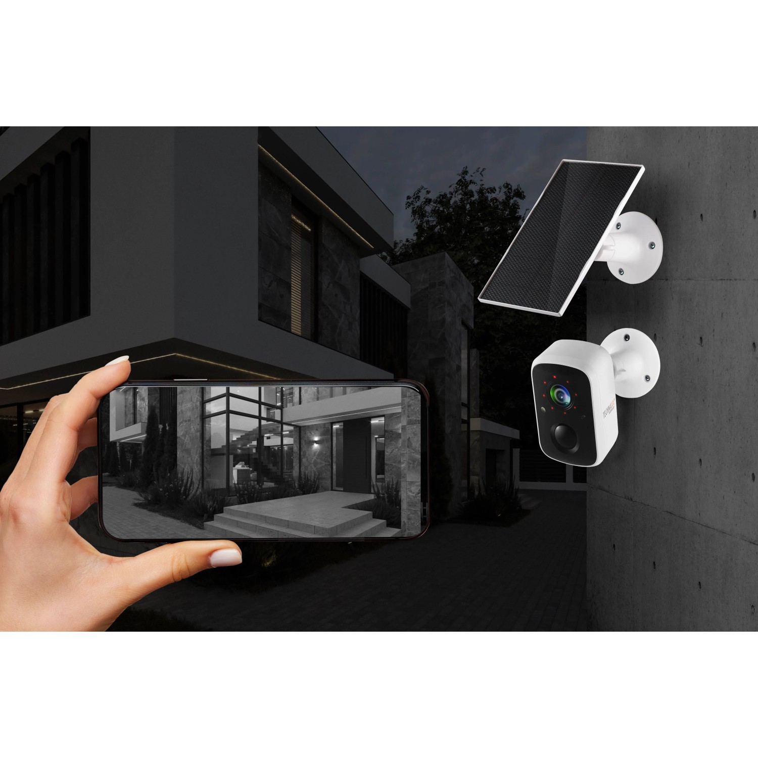 Technaxx Outdoor-Kamera TX-244 Solar mit Solarpanel und Smartphone-Ansicht eines Hauses.
