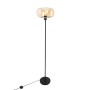 Art Deco Stehlampe Bizle in Schwarz mit braunem Glas. Elegante Innenleuchte für Wohnräume.