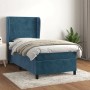 Dunkelblaues Boxspringbett (80x200 cm) mit Samtbezug, Matratze und Kopfteil im Schlafzimmer.