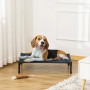 Hund liegt entspannt auf blauem PawHut Hundebett/Hundeliege Outdoor. Ideal für mittelgroße Hunde.