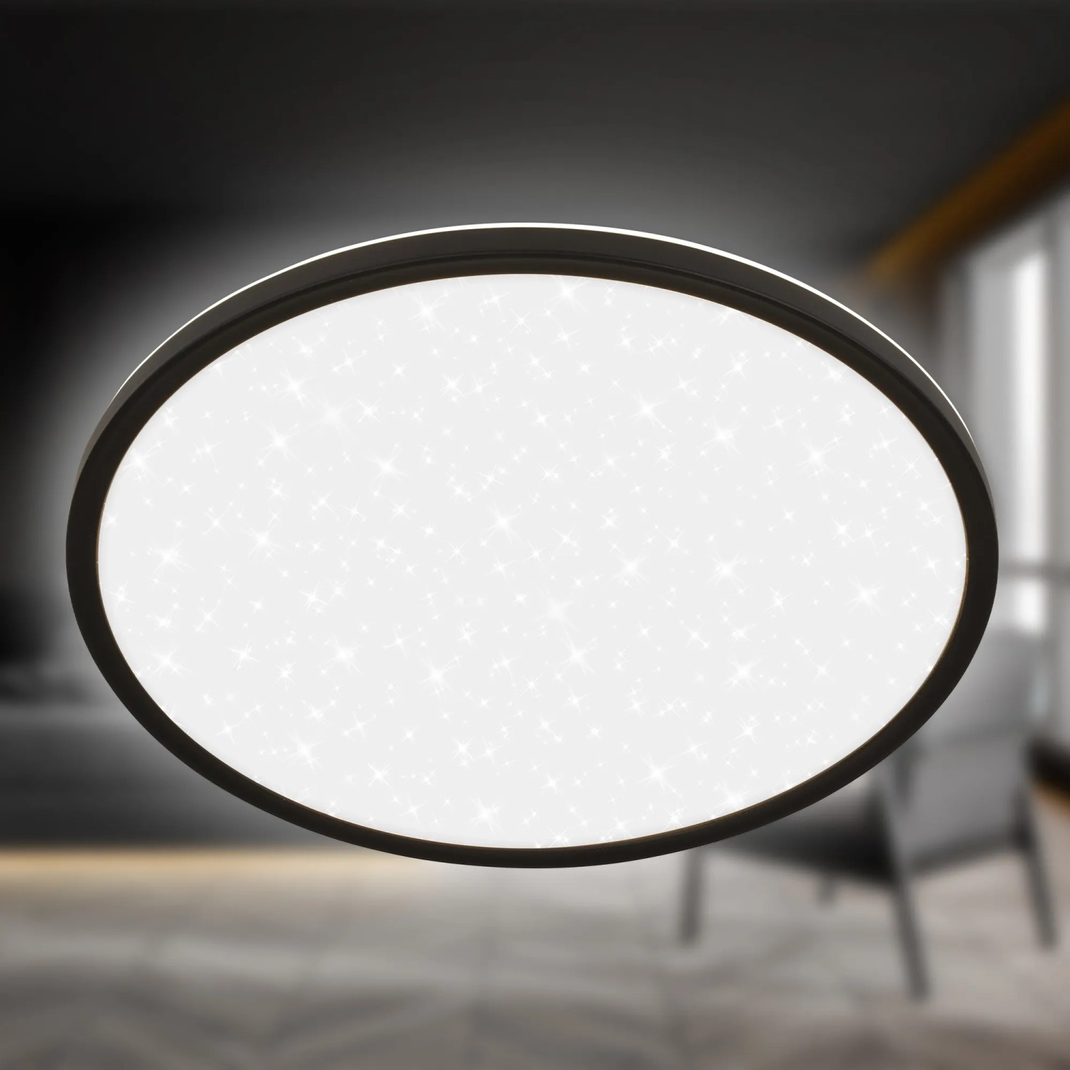 Schwarzes Brilo LED-Panel Slim Sternenhimmel, neutralweiß, Ø 37,5 cm.