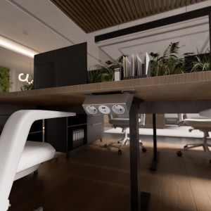 Kalb Nexura Tischsteckdose mit 2x 230V, USB-A/C, 30W, C-Klemme unter einem Schreibtisch.