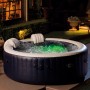Intex PureSpa Plus aufblasbarer Whirlpool mit LED-Beleuchtung und Kopfstützen im Garten.