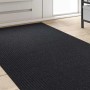 vidaXL Teppichläufer Anthrazit 80x250 cm aus Stoff mit gerippter Oberfläche auf hellem Holzboden im Flur.