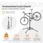 Schwarzer, höhenverstellbarer Fahrradmontageständer mit rotem Drehclip, magnetischer Ablage und montiertem Fahrrad.