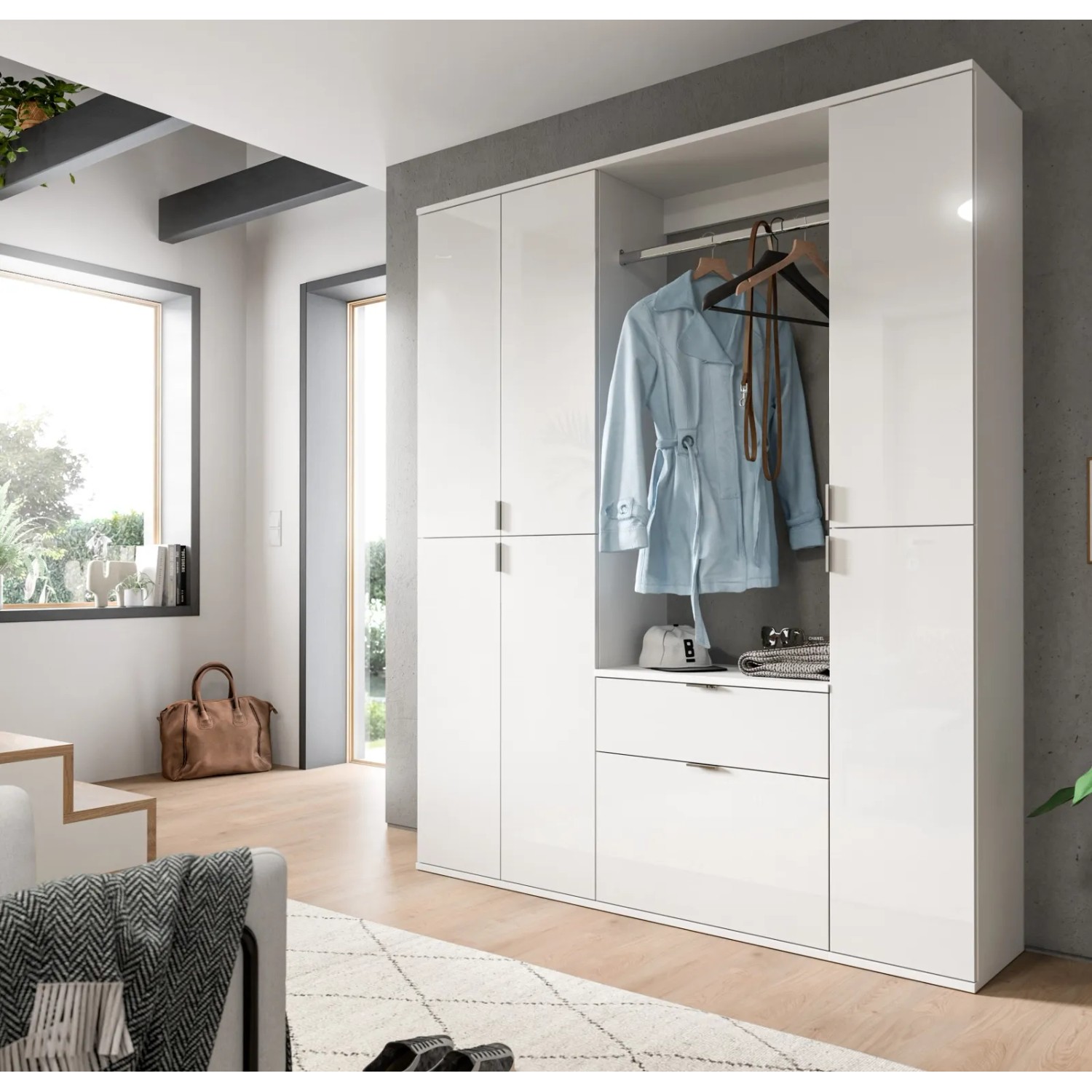 Weiße Hochglanz Garderobe SystemX mit Kleiderstange, Schubladen und Fächern für den Flur.