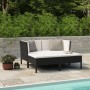 Schwarzes 4-tlg. vidaXL Garten-Lounge-Set aus Rattan mit cremeweißen Auflagen im Garten.