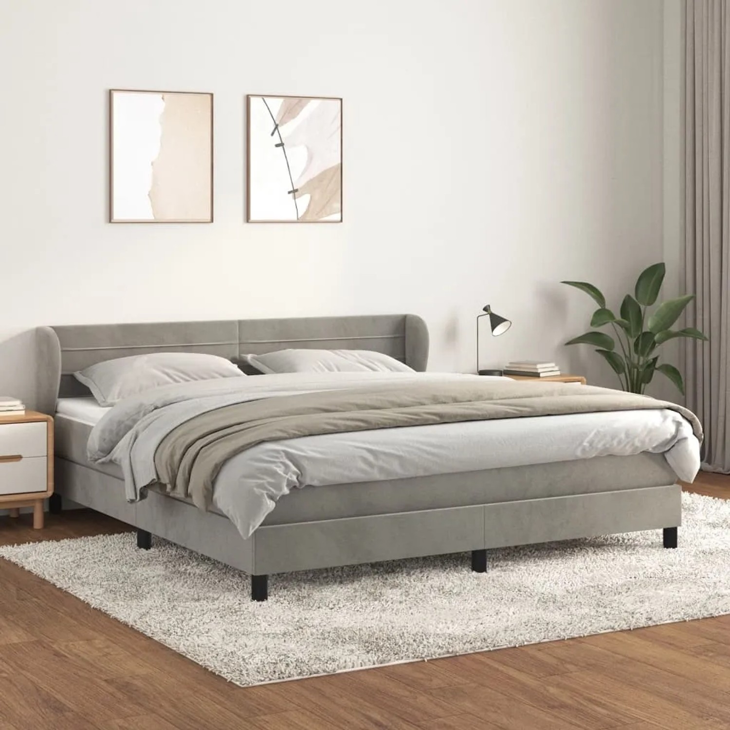 Hellgraues Boxspringbett 160x200 cm mit Matratze und Samtbezug.