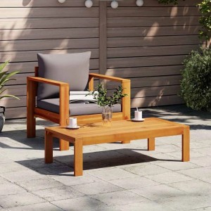 vidaXL Gartensessel aus Akazien-Massivholz mit dunkelgrauen Kissen auf Terrasse. Robuster Outdoor-Stuhl.
