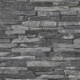 Schwarze Vliestapete Naturals mit Steinmuster für dekorative Wandgestaltung.