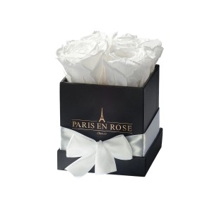 Eckige Rosenbox Schwarz mit Schleife und 4 weißen Rosen. Dekorativer Blumenstrauß.