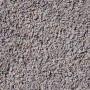 Nahaufnahme von hellgrauem Fugensand (1-3 mm) als Schüttgut.