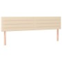 Cremefarbenes Boxspringbett mit Matratze, Stoffbezug und Kopfteil. Bett für erholsamen Schlaf.