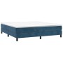 Dunkelblaues Boxspringbett (160x200 cm) mit Samtbezug und weißer Matratze.