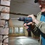 Bosch Professional Akku-Schlagbohrschrauber GSB 12V-15 beim Bohren in Mauerwerk.
