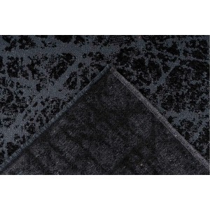 Grauer Kurzflor Teppich (120x170 cm) im modernen Design mit Reliefstruktur.