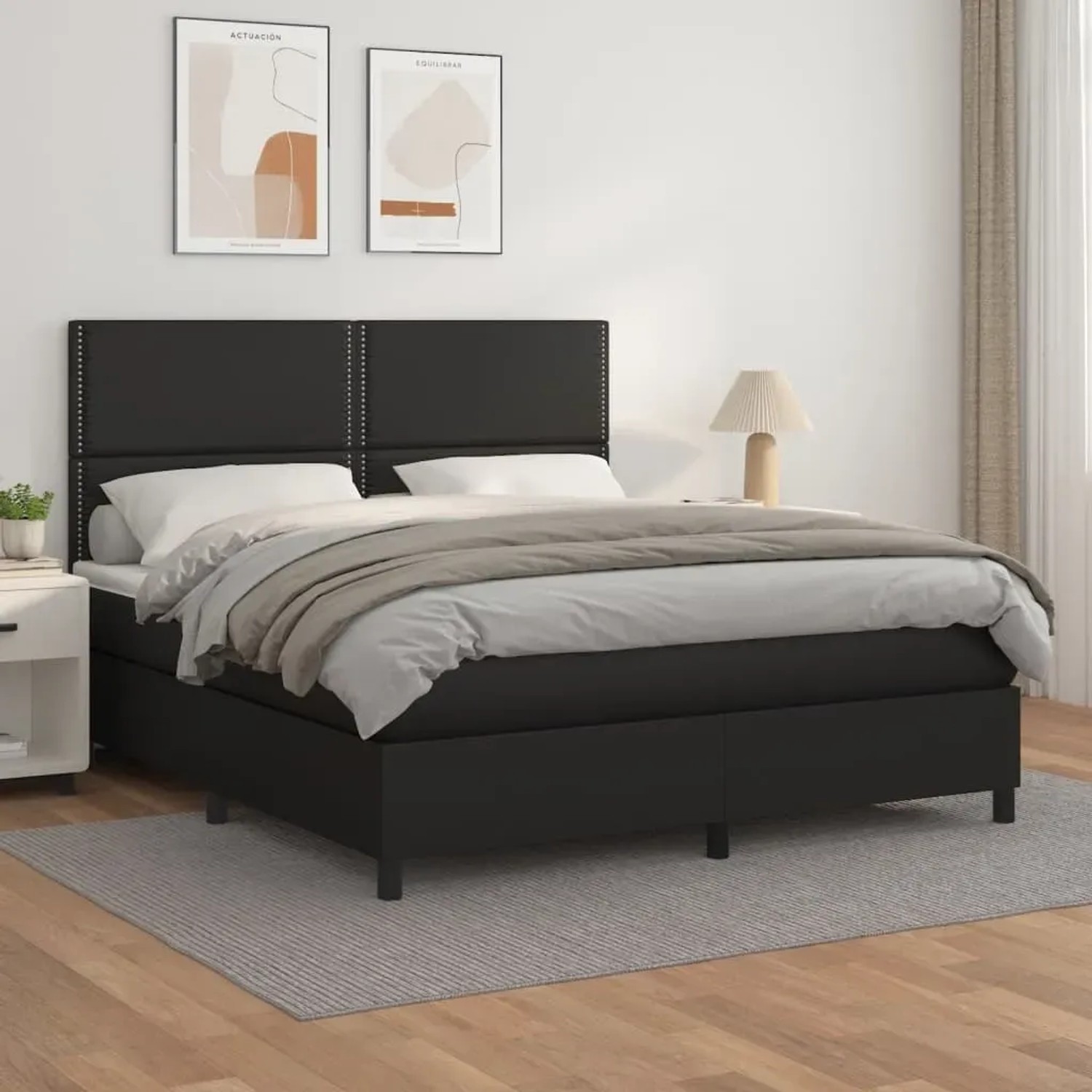 Schwarzes vidaXL Boxspringbett (180x200 cm) mit Kunstlederbezug und Matratze.