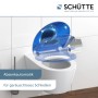 Schütte WC-Sitz Shark mit Absenkautomatik und Hai-Motiv auf einem weißen WC.