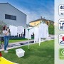 Leifheit Wäschespinne Linomatic V 40m im Garten mit aufgehängter Wäsche und Frau.