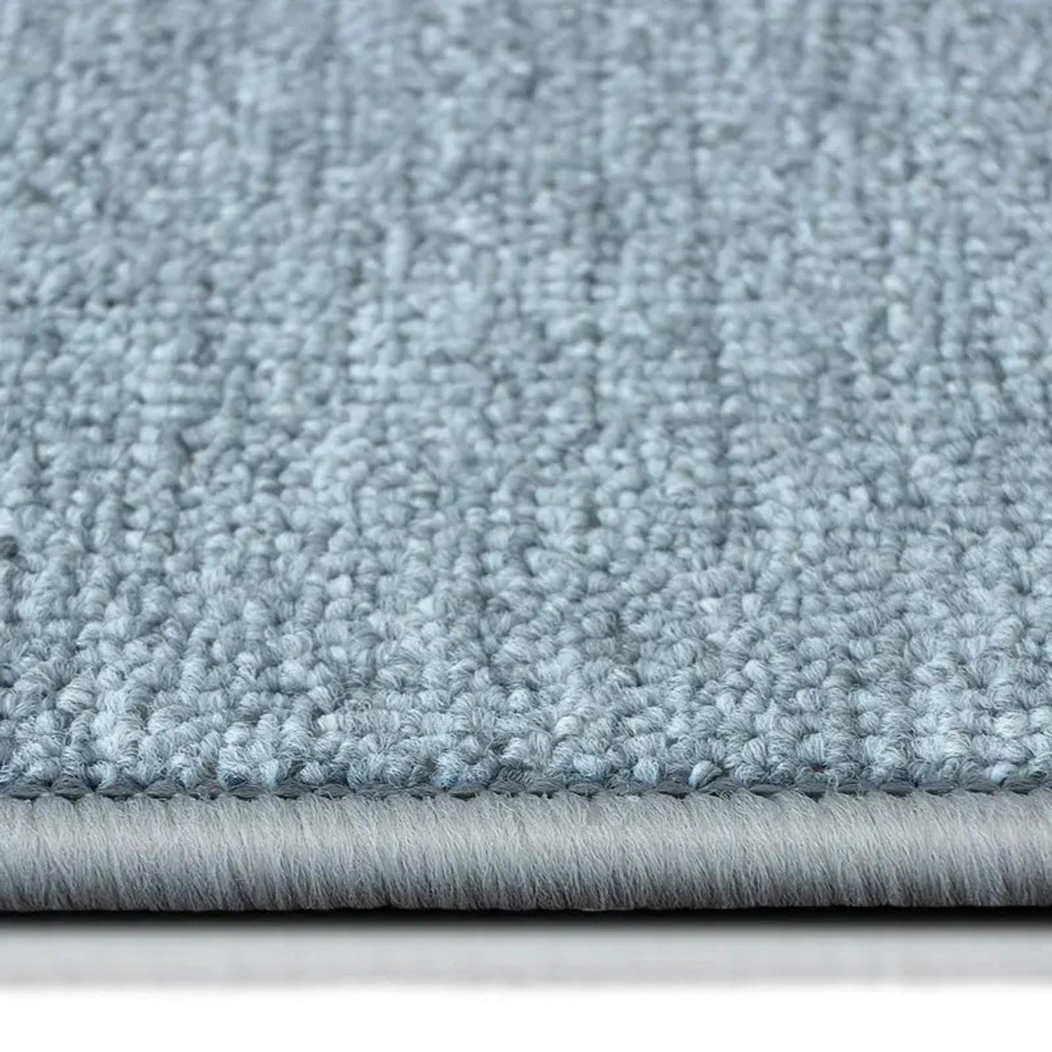 Detailaufnahme: Hellgrauer, runder KARAT Teppich London mit Schlingenflor.