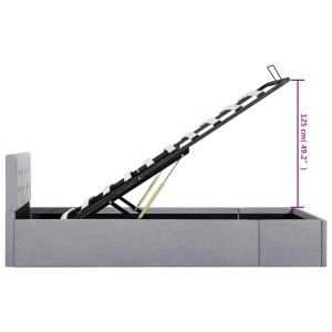 Hellgraues Stauraumbett (100x200 cm) mit geöffnetem Lattenrost und Gasdruckfedern.