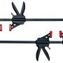 Zwei schwarze Metabo Schraubzwingen mit roten Details für den Multifunktionstisch.