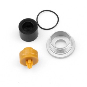 Topeak Reparaturset Mini Morph: Gelbes Ventilteil, schwarze Dichtung, silberner Ring für Luftpumpen.