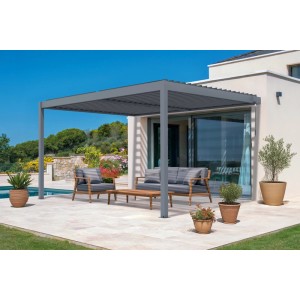 Graue Cazeboo Piana Bioklimatische Anlehnpergola 4x3m aus Aluminium mit Gartenmöbeln.