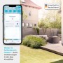 Homematic IP App auf Smartphone zeigt Wetterdaten und Hausautomation im Garten. Smart Home Steuerung.