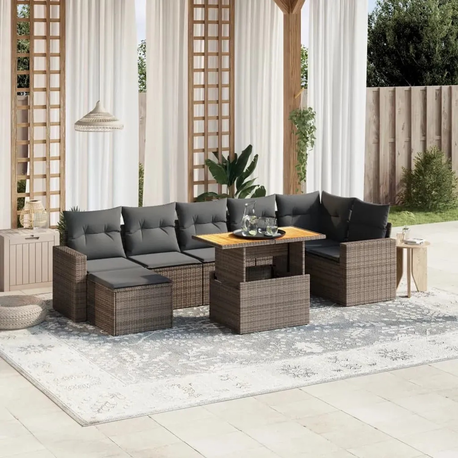 8-tlg. graue Garten-Sofagarnitur aus Polyrattan mit Kissen und höhenverstellbarem Tisch.
