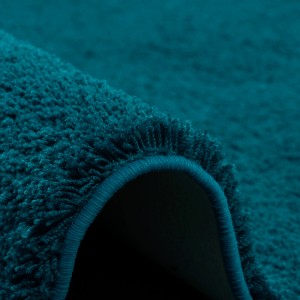 Detailansicht: Flauschiger, petrolfarbener Hochflor Teppich (Snapstyle Palace).