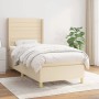 Cremefarbenes Boxspringbett 80x200 cm mit Matratze und Kopfteil im Schlafzimmer.