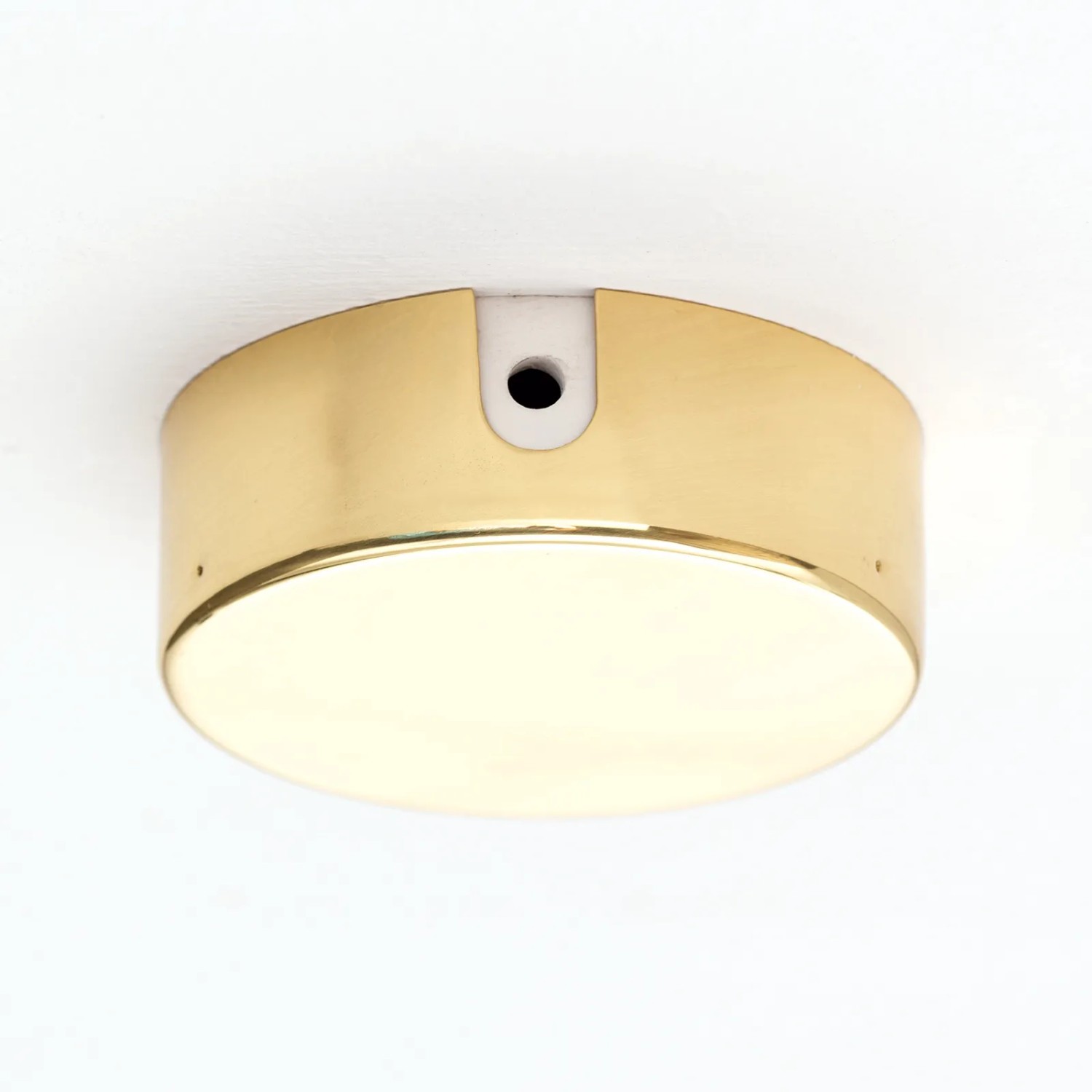 Goldene Orion Lightstyle Verteilerdose aus Metall (Ø 70 mm) zur Kabelverdeckung an Decken.
