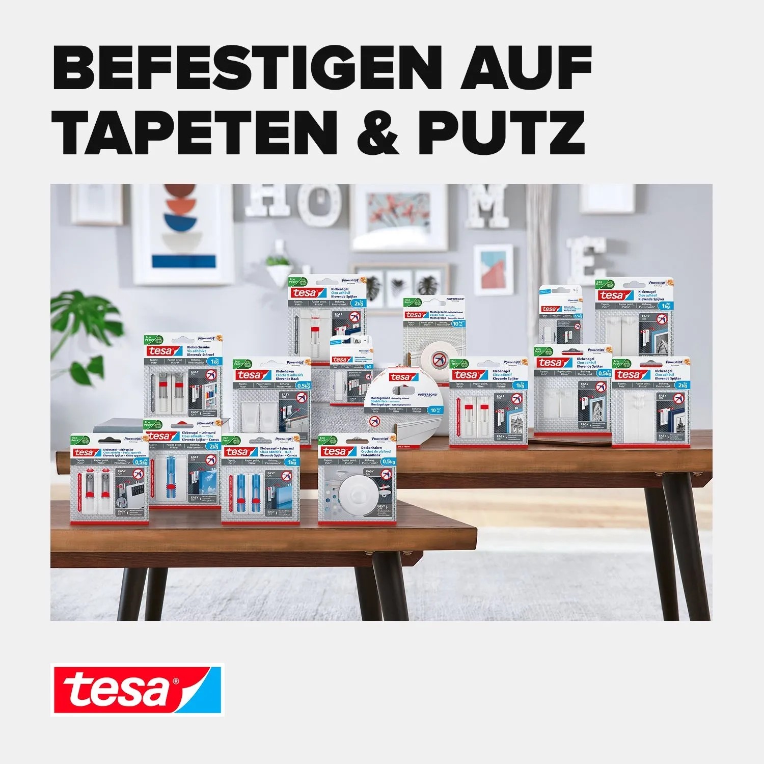 Tesa Klebestreifen und Klebenägel für Tapeten und Putz auf Holztisch. Ideal für empfindliche Untergründe, spurlos ablösbar.