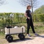 Schwarzer Sunny Bollerwagen Billy Beach Wagon mit Luftreifen und Holzaufbau im Einsatz.