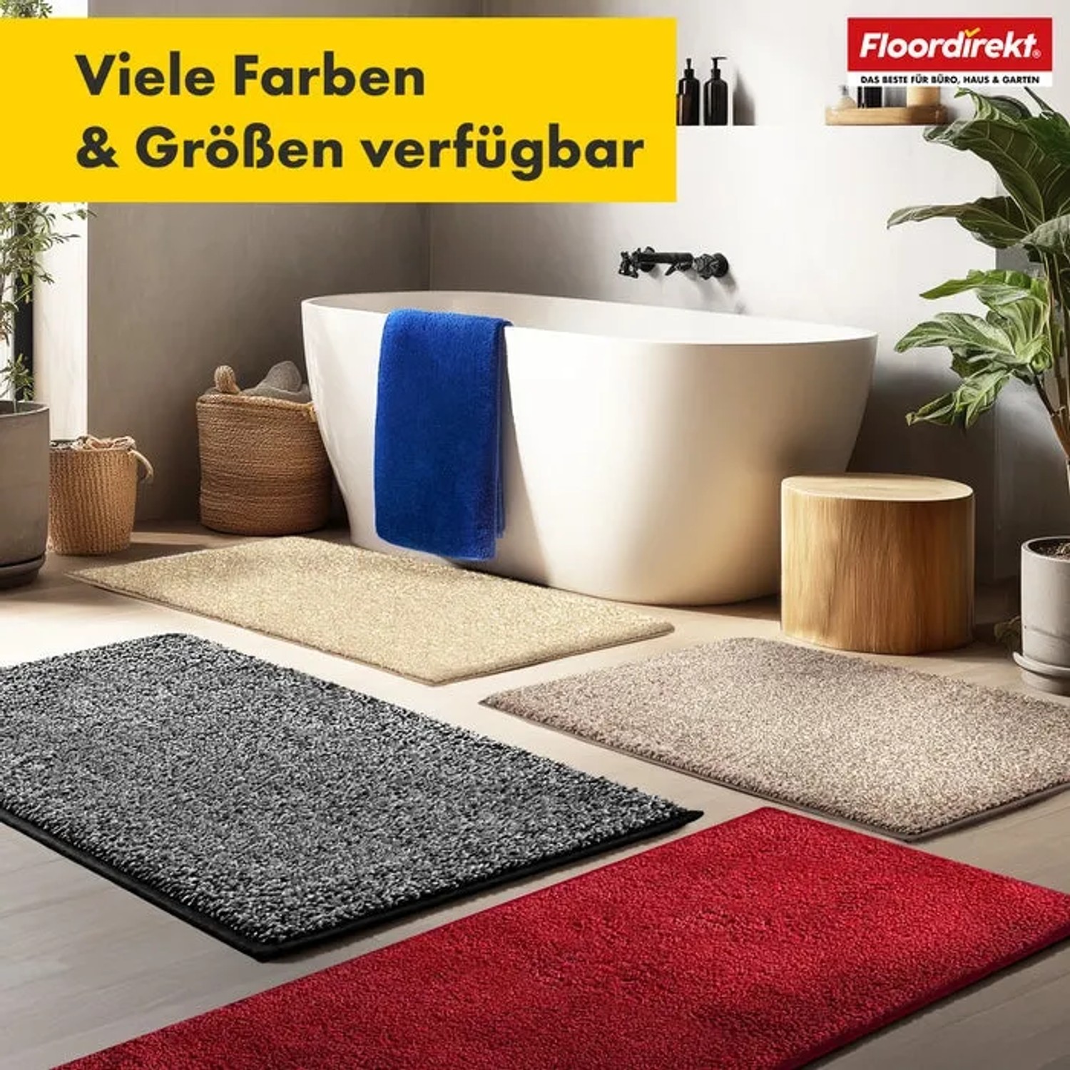 Verschiedene farbige Floordirekt Badematten Nasa (Rot, Grau, Beige) im Badezimmer mit Badewanne.