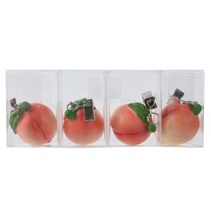 4 Tischdeckenbeschwerer in Pfirsich-Form mit Clips, orange-grün, aus Polyresin.