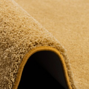 Detailansicht: Curryfarbener Snapstyle Hochflor Teppich Palace, 133x133cm. Flauschiger Shaggy Teppich.