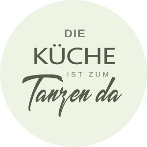 Rundes Glasbild Küche mit dem Spruch: Die Küche ist zum Tanzen da.